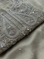Soft Beige Designer Suit with Elegant Threadwork & Embellished Neckline